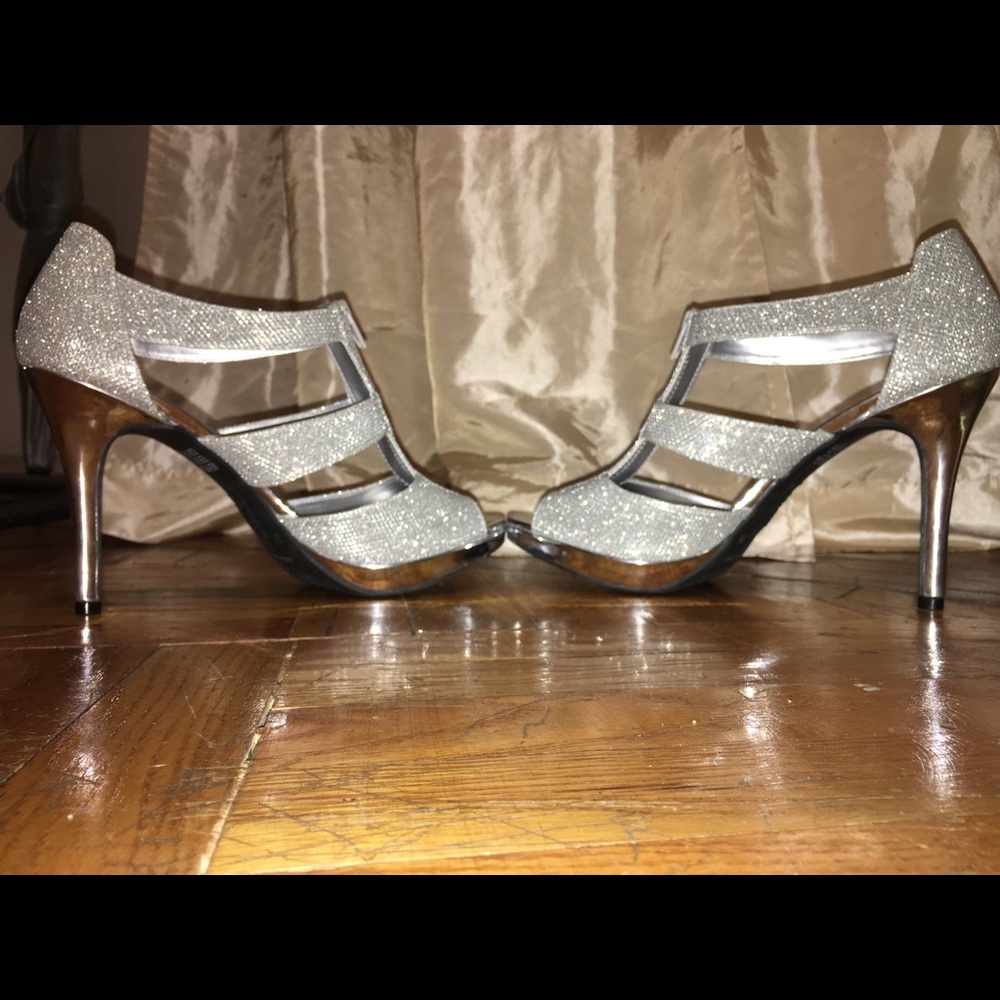 New never worn Silver stiletto high heel size 10